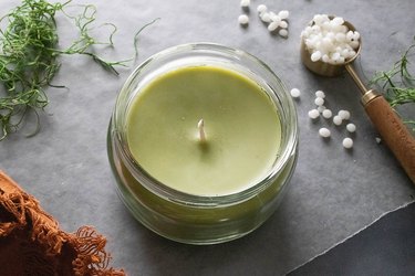 Green candle in a jar