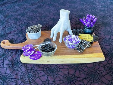 fill in around the bowls with purple lollipops and black licorice