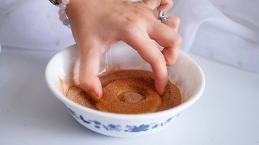 coating apple slices in cinnamon sugar