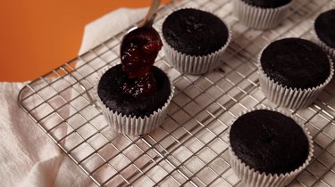 Filling cupcake cavity with cherry jam
