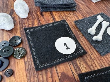 use decorative sewing machine stitch on black felt squares