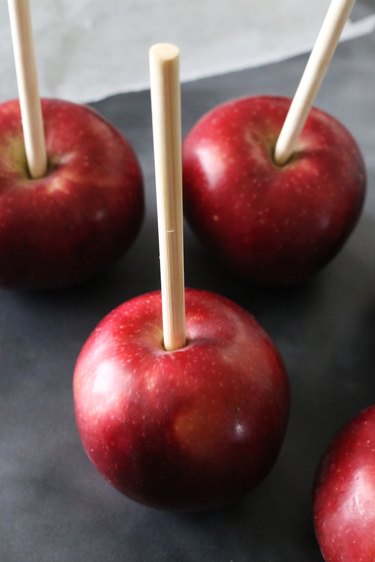 Red apples with bamboo treat sticks