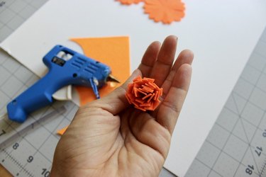 A folded cylinder of orange felt