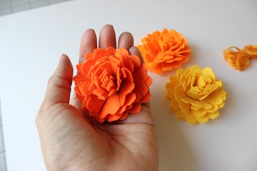Three marigolds made of yellow, orange and red felt