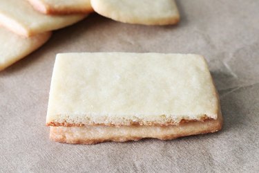 Stack of sugar cookies on parchment paper