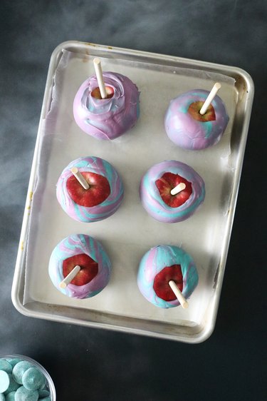 Candy apples on a baking sheet