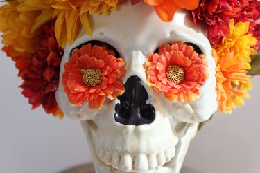 Flowers in skull's eyes.