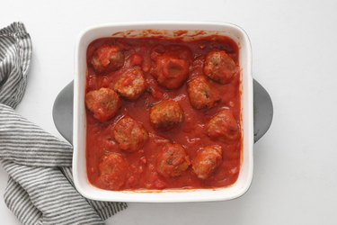 Bake meatballs in sauce in the oven