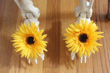 Flowers on skeleton's feet.