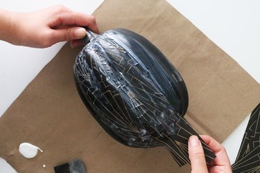 Add strips of tissue paper on foam pumpkin