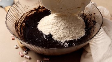 Adding dry ingredients to cookie batter
