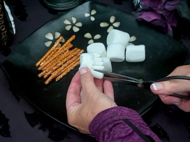 cut marshmallows for brooms