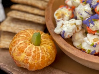 mini pumpkin made from peeled orange with celery stem