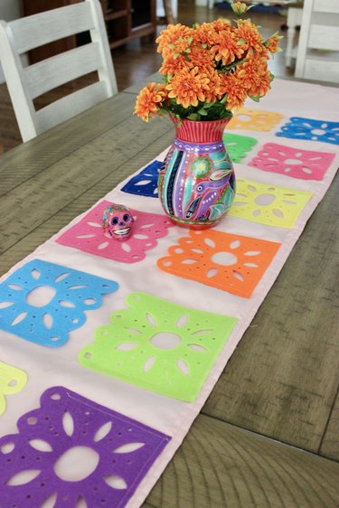 Day of the Dead table runner with vase on top