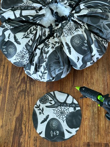 cut a fabric circle to cover opening