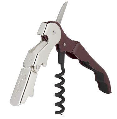 Truetap wine opener in burgundy, shown open in 3/4 view against a white ground