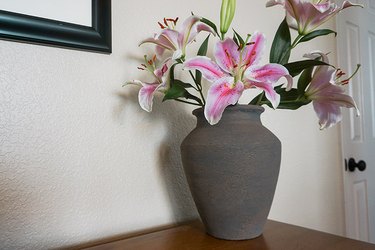 Gray baking soda painted vase with beautiful lilies