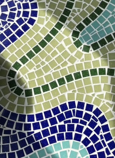 Blue and green mosaic tile on a desktop