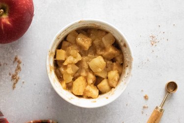 Apple cinnamon crisp filling in a ramekin