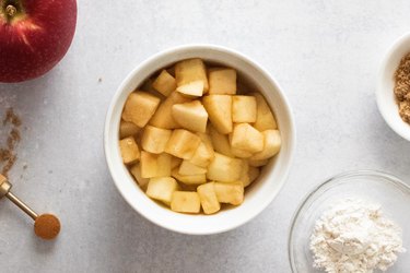 Softened apples in a ramekin