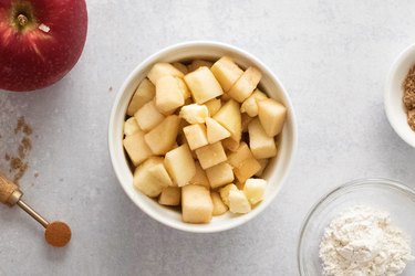 Diced apples and butter in a ramekin