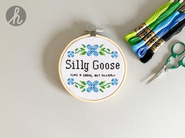 Cross-stitch circle reading "Silly Goose (like a goose, but sillier)"