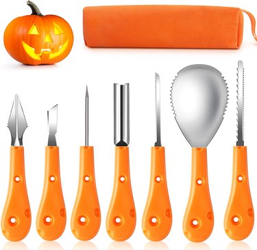 7 metal pumpkin carving tools with orange handles an orange storage case.