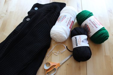 Materials to create a cozy cat-eye sweater