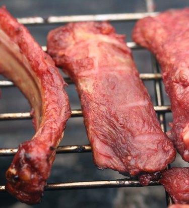 Boiling country style shop ribs before grilling