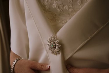 How to Attach a Loop & Button to Hold Up a Wedding Dress Train, eHow