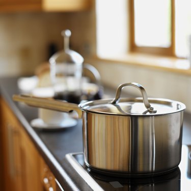 close-up of a saucepan on a burner in the kitchen