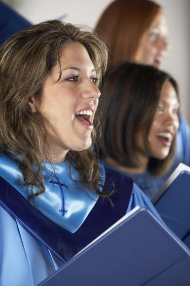 Woman in church choir singing