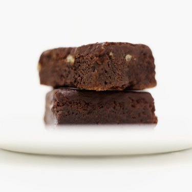 Close-up of a pile of two chocolate brownies on a plate
