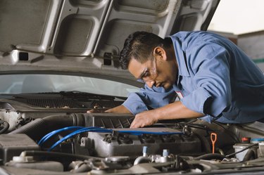 Mechanic fixing engine