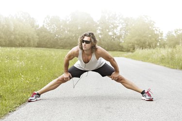 runner stretches his legs