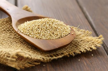 Natural organic cereal quinoa on a wooden table