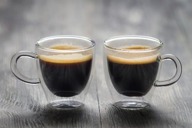 Closeup of two small cups with espresso