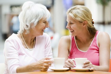 Smiling woman having coffee