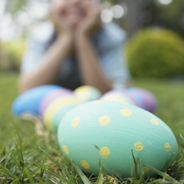 Boy and Easter eggs on lawn (focus on foreground)