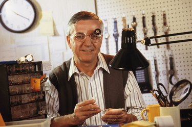 Man repairing wristwatches