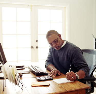 Mature man working in  home office