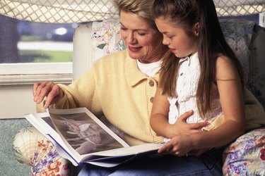 caucasian grandmother and child reading