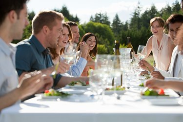 People enjoying outdoor dinner party