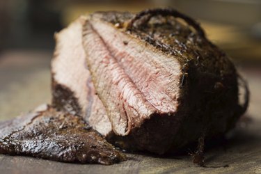 Piece of roasted beef, veal, cut in slices, delicious homemade