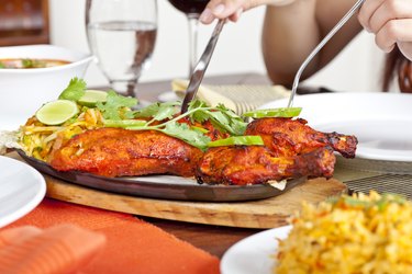 Eating Indian Food Chicken Tandoori