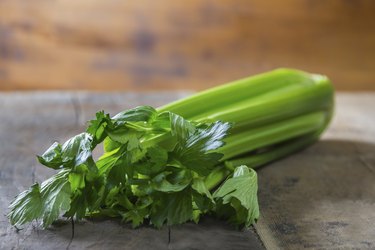 Celery on wooden table