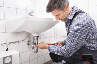 Plumber Fitting Sink Pipe