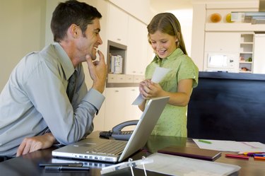 Daughter showing businessman picture