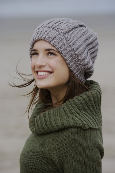 Woman in sweater and cap