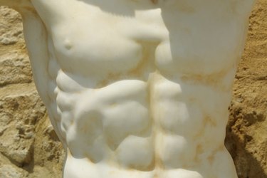 Chiseled abdomen on marble statue